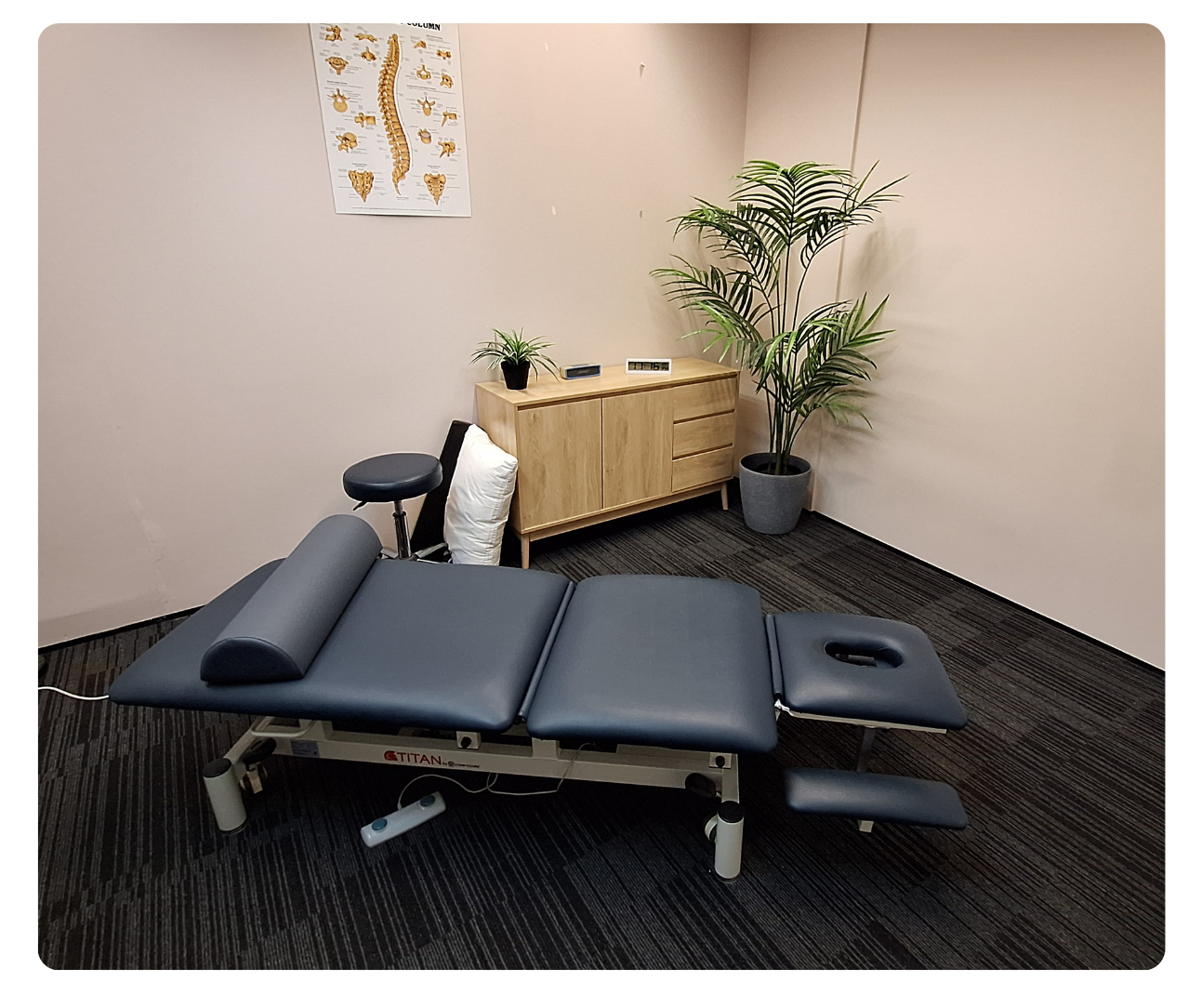 Fully equipped massage table with plush padding and professional-grade supplies.